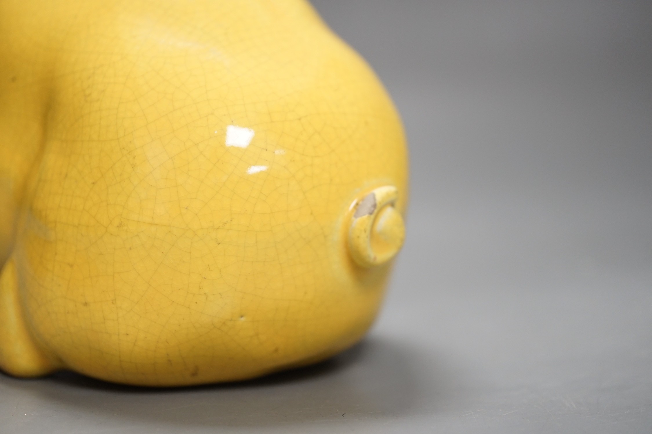 A Wemyss ware yellow glazed pig, 17cms long